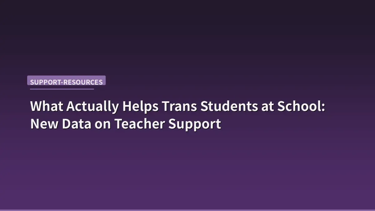 A teacher's desk with a small progress pride flag pin next to a stack of graded papers, warm classroom lighting